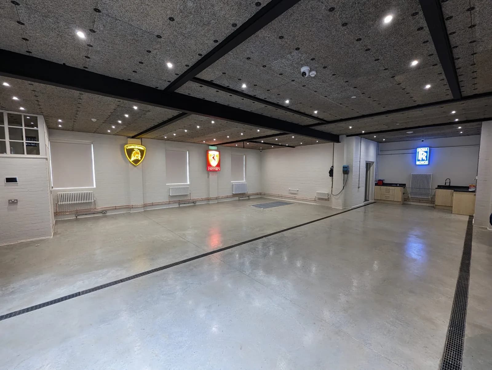 Commercial showroom fit-out with polished floor and suspended ceiling